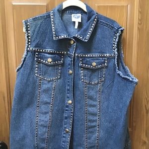 Denim vest with grommets.